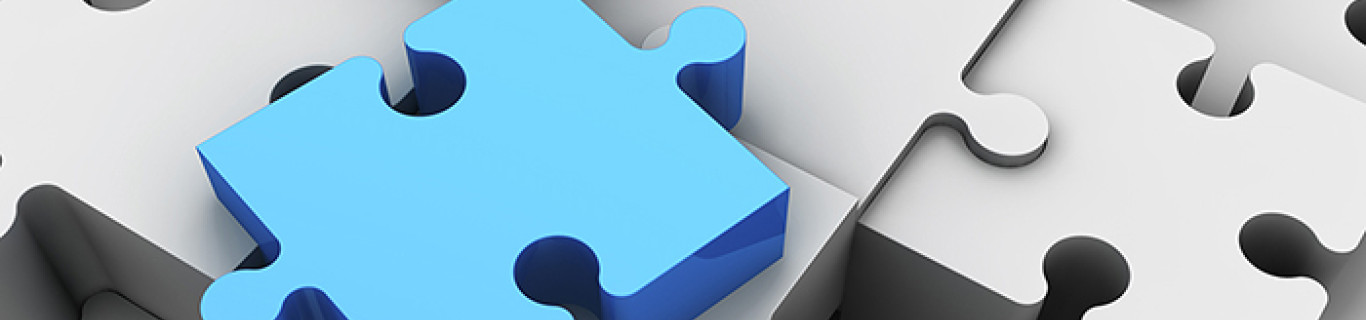 puzzle białe z jednym niebieskim puzzlem